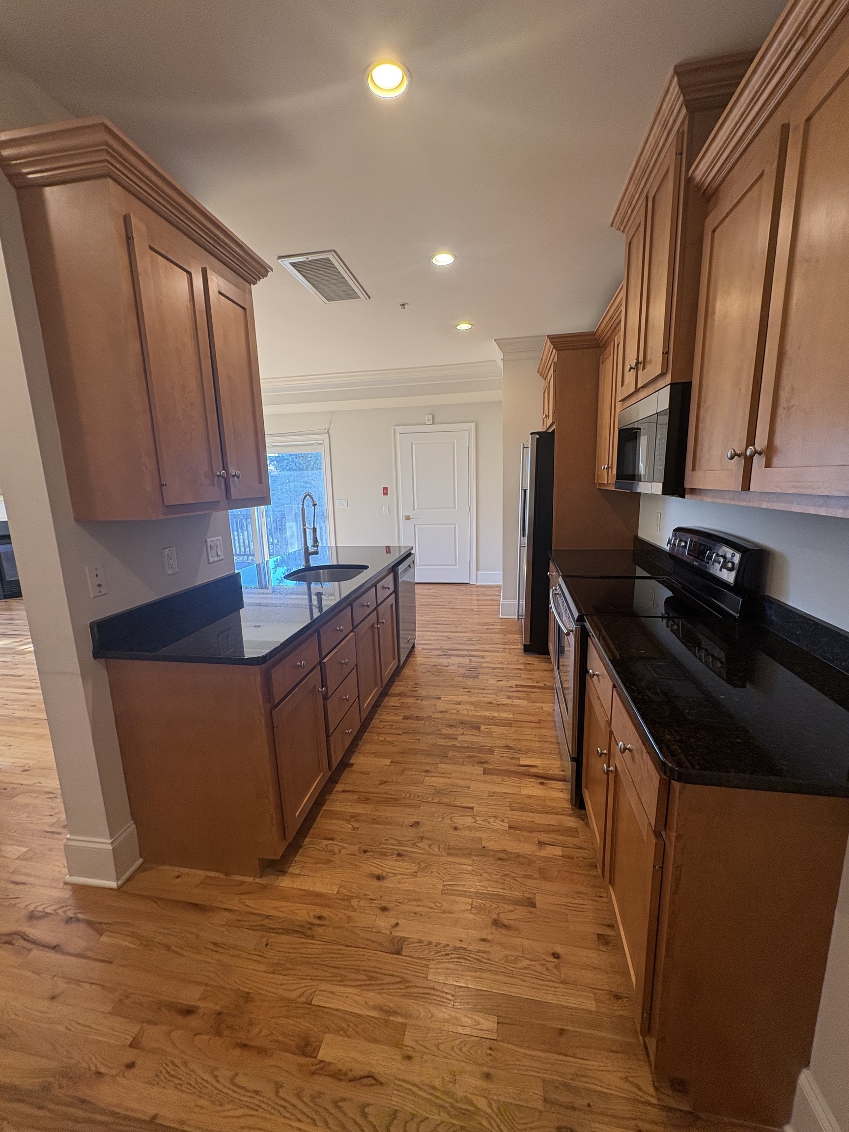 21 Seir Hill Road, Unit 6 Norwalk, CT 06850 - Photo 3 of 22 a kitchen with stainless steel appliances granite countertop a stove a sink and a refrigerator