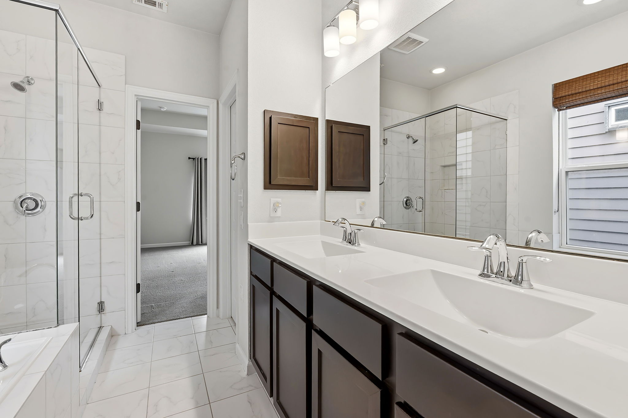 4409 Festival Path, Unit 26 Austin, TX 78741 - Photo 13 of 21 a bathroom with double sink and a mirror