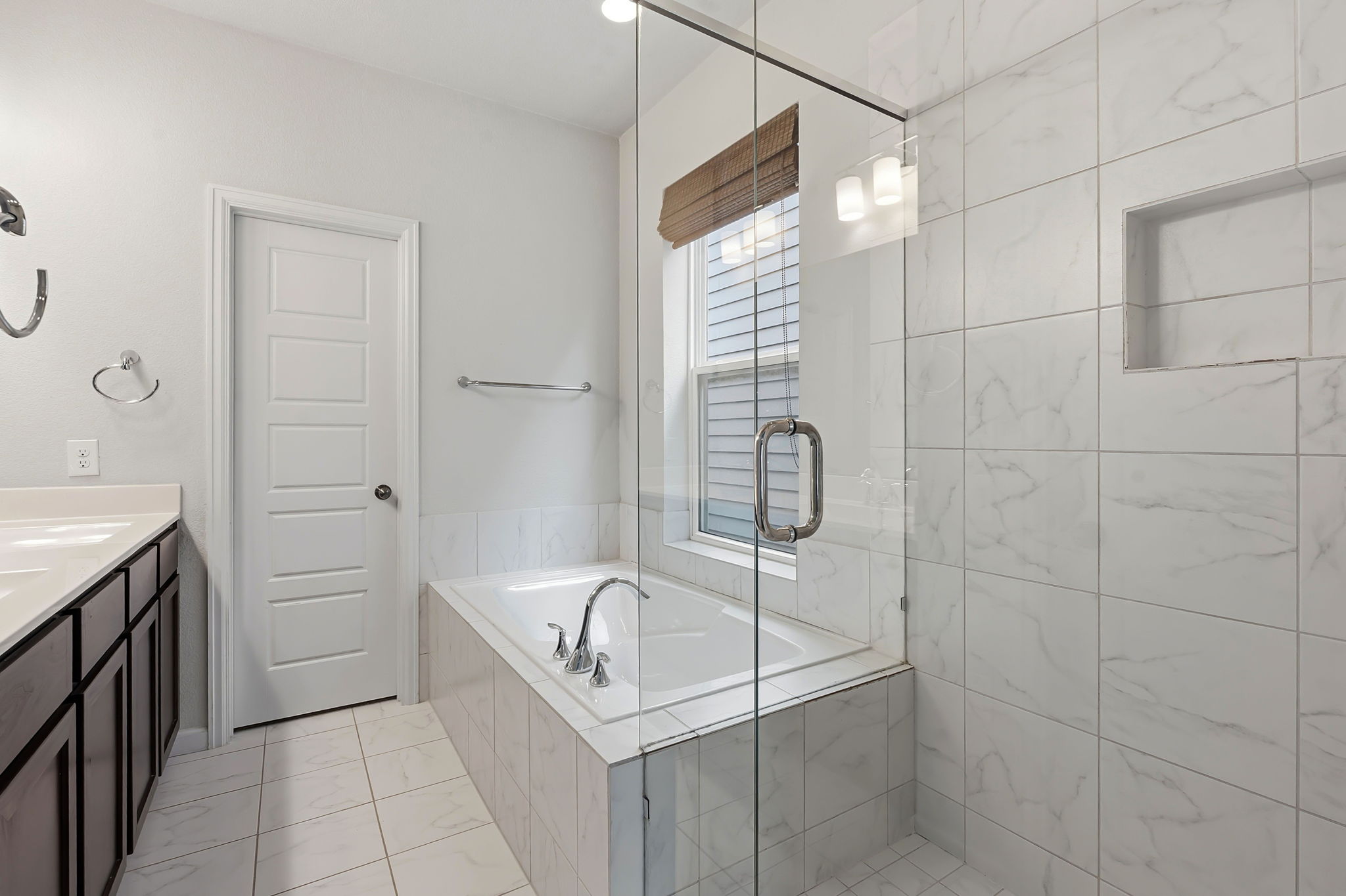 4409 Festival Path, Unit 26 Austin, TX 78741 - Photo 18 of 24 Full bath featuring vanity, a stall shower, and a bath