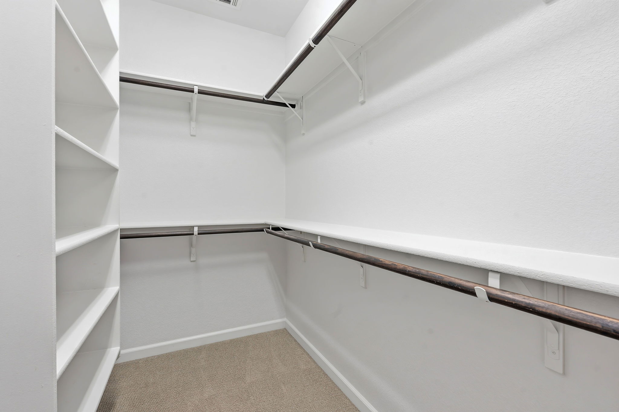 4409 Festival Path, Unit 26 Austin, TX 78741 - Photo 19 of 24 Walk in closet featuring light carpet