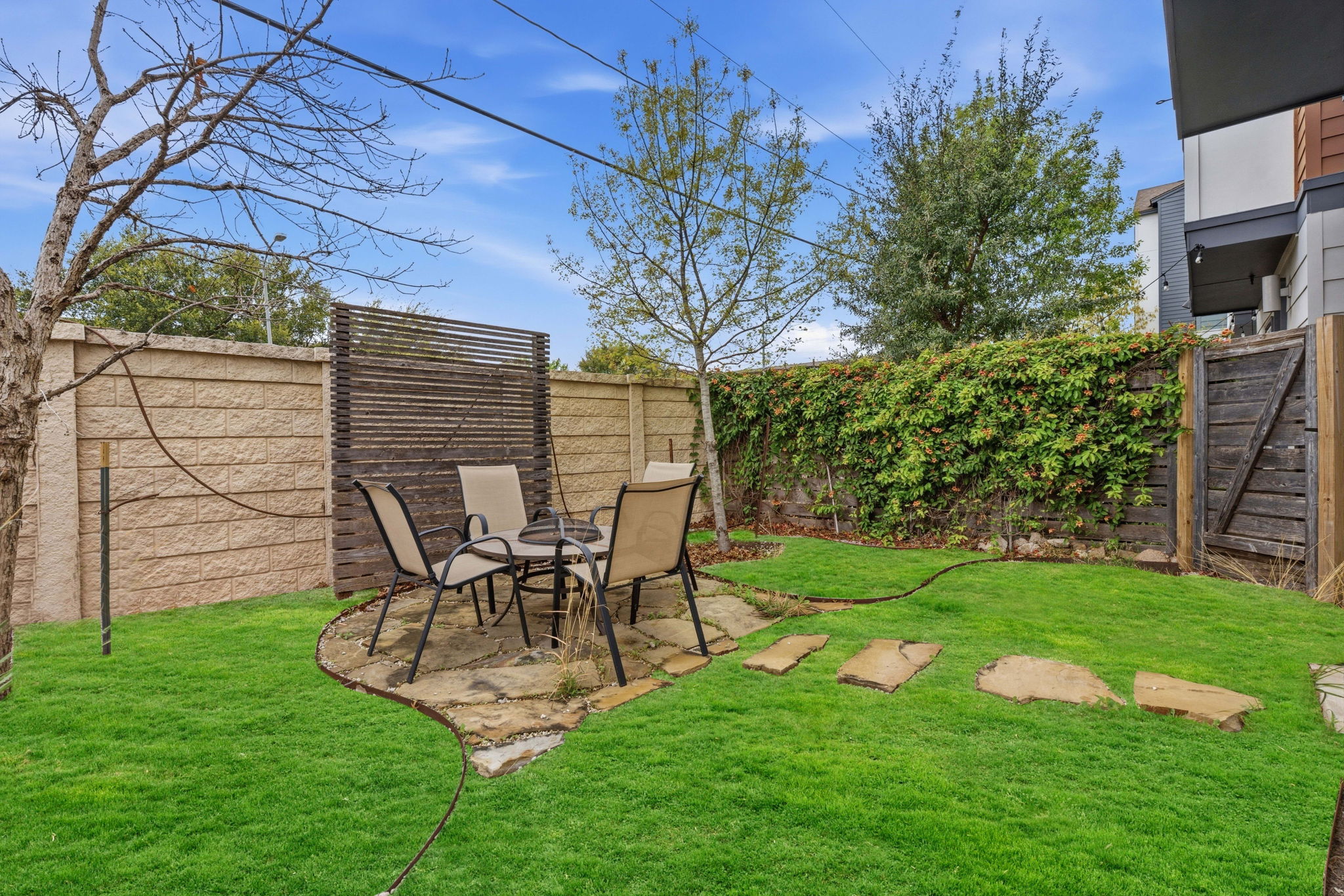 4409 Festival Path, Unit 26 Austin, TX 78741 - Photo 23 of 24 Fenced backyard with a patio