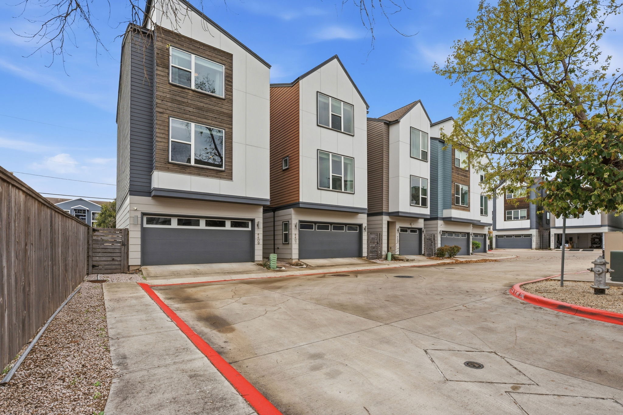 4409 Festival Path, Unit 26 Austin, TX 78741 - Photo 24 of 24 Contemporary home with a garage and concrete driveway