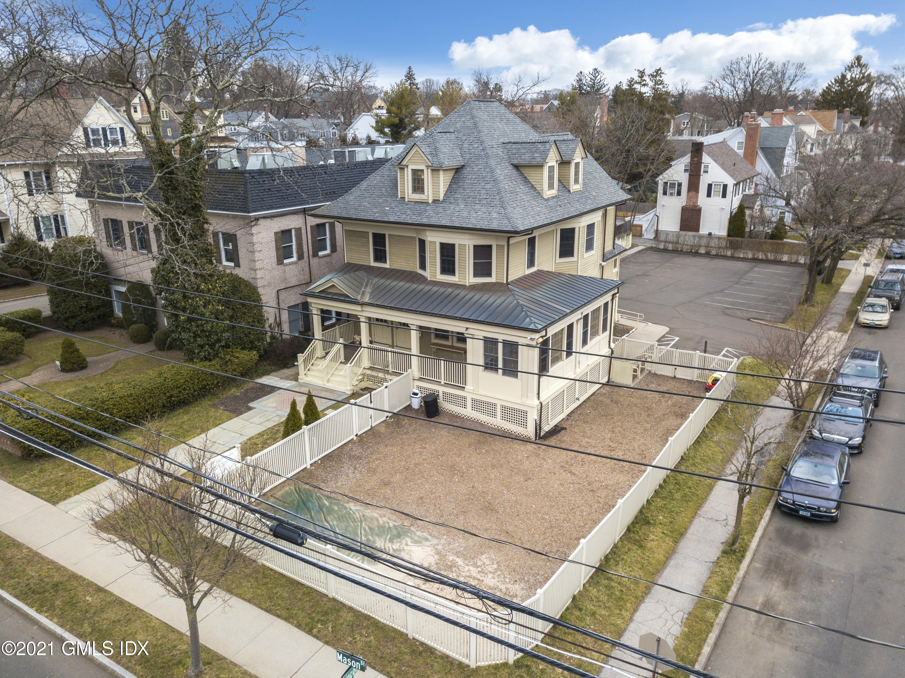 75 Mason Street Greenwich, CT 06830 - Photo 6 of 11 a view of a white house with a large windows