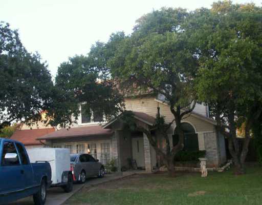 a view of a car park in front of house