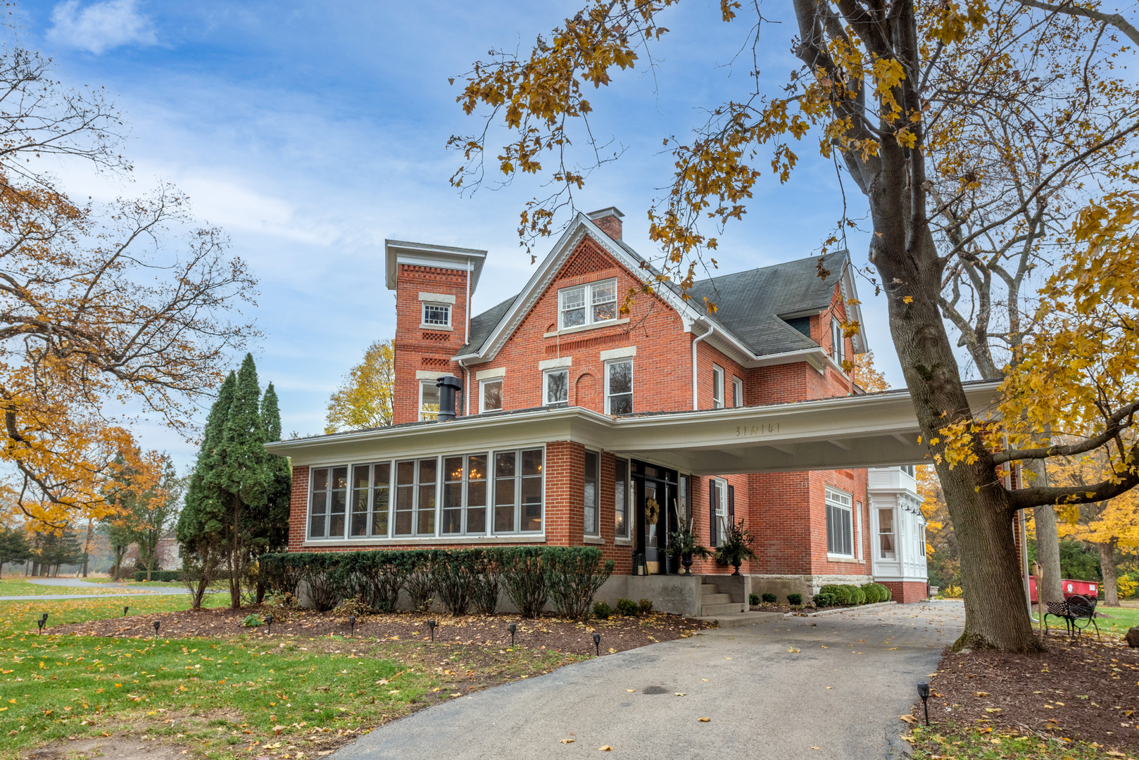 31W141 Army Trail Road Wayne, IL 60184 - Photo 2 of 63 a front view of a house with garden