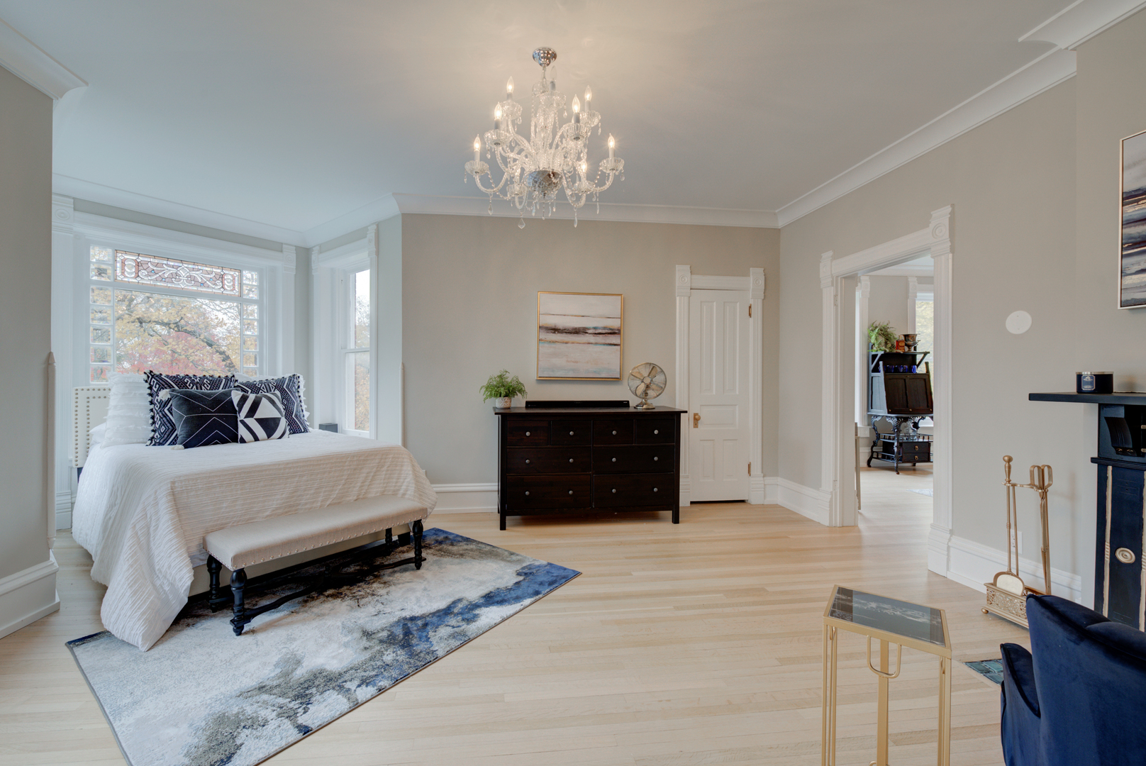 31W141 Army Trail Road Wayne, IL 60184 - Photo 26 of 63 a spacious bedroom with a bed and a chandelier