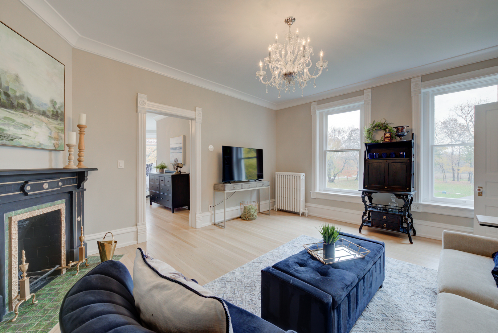 31W141 Army Trail Road Wayne, IL 60184 - Photo 27 of 63 a living room with furniture a fireplace and a flat screen tv