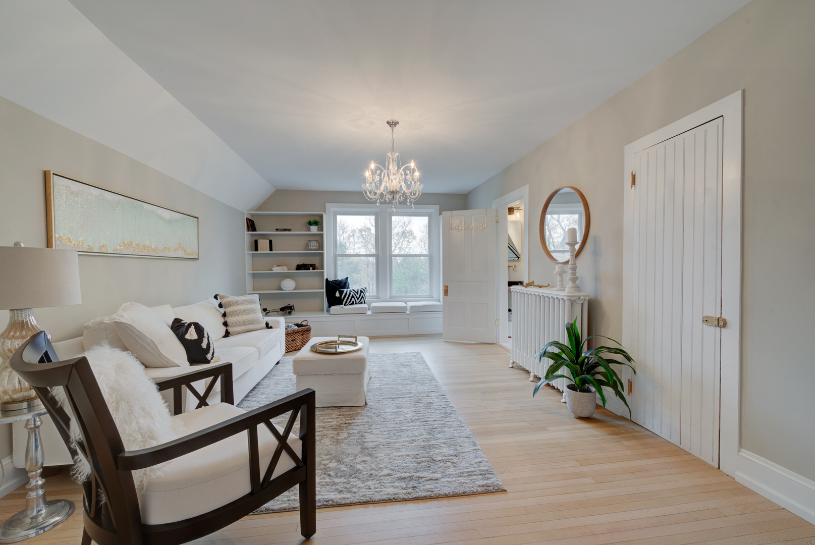 31W141 Army Trail Road Wayne, IL 60184 - Photo 43 of 63 a living room with furniture a chandelier a mirror and a window
