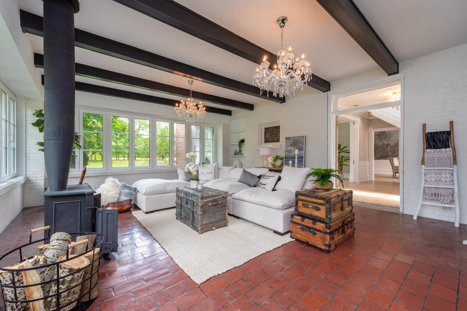 31W141 Army Trail Road Wayne, IL 60184 - Photo 7 of 63 a living room with furniture a chandelier and a large window