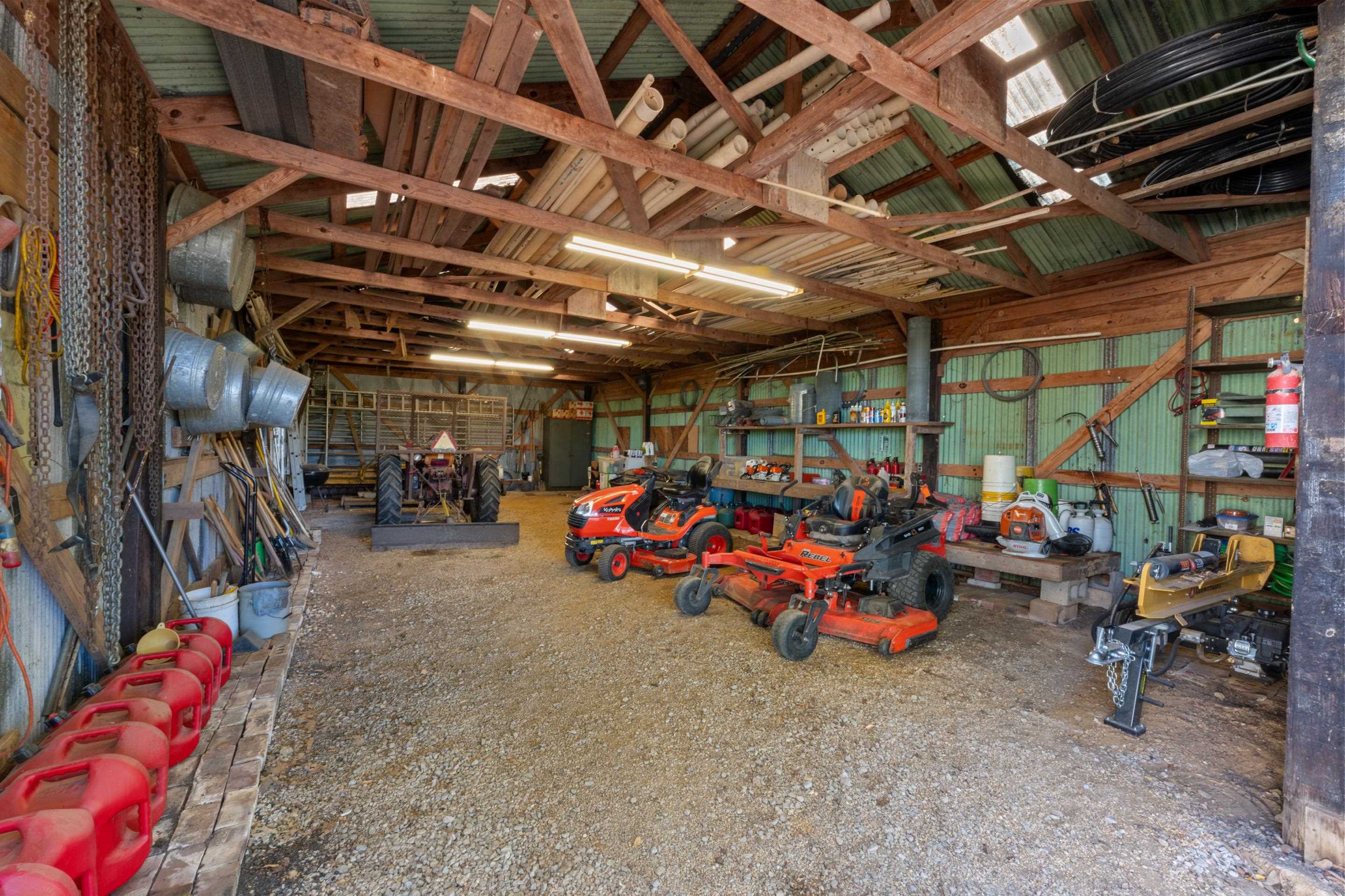 650 Blain Road Rossville, TN 38066 - Photo 25 of 26 This barn/shop includes a gravel floor and a semi-enclosed covered lean-to, providing extra space for storage or work. The flexible layout accommodates a variety of practical uses on this large property.