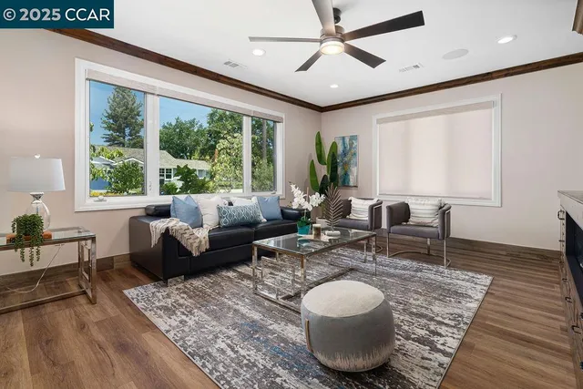 a view of a livingroom with furniture and a fireplace
