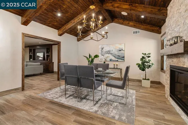 a living room with furniture and a ceiling fan