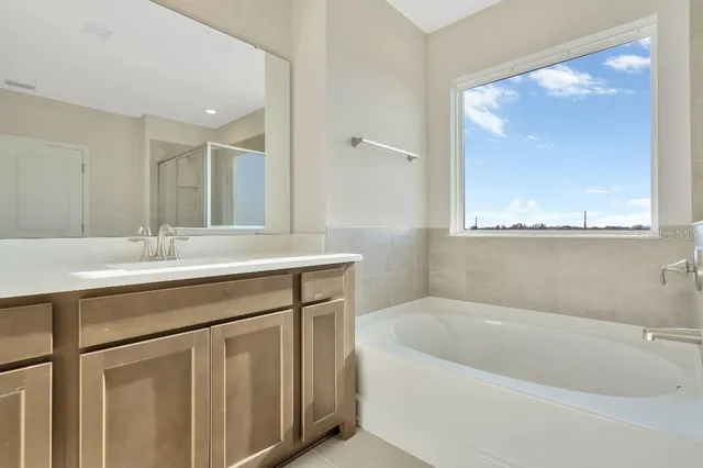 an aerial view of residential houses with yard