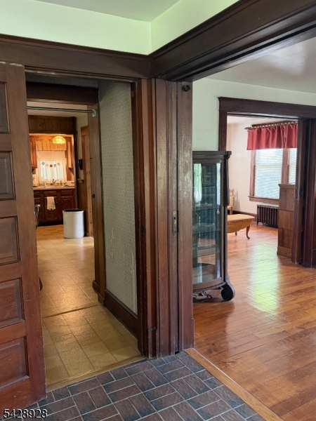 13 Cemetery Road Great Meadows, NJ 07838 - Photo 3 of 20 a view of a hallway with dining room and chandelier