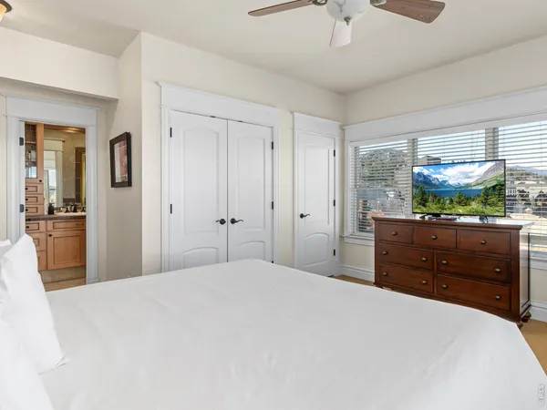 a bedroom with a bed and a dresser