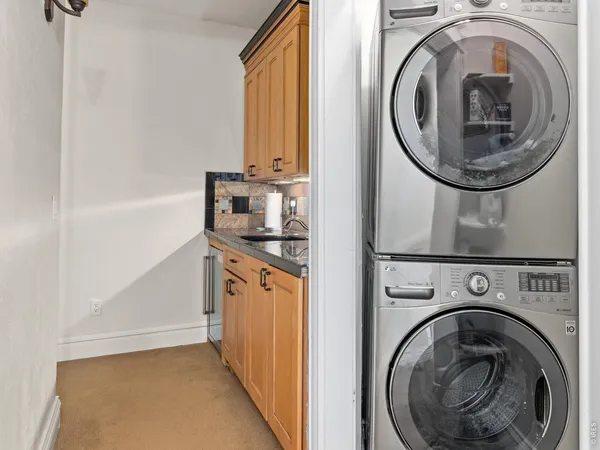 a view of a hallway with washer and dryer
