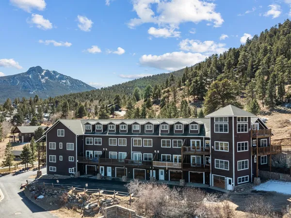 a view of a large building with a mountain
