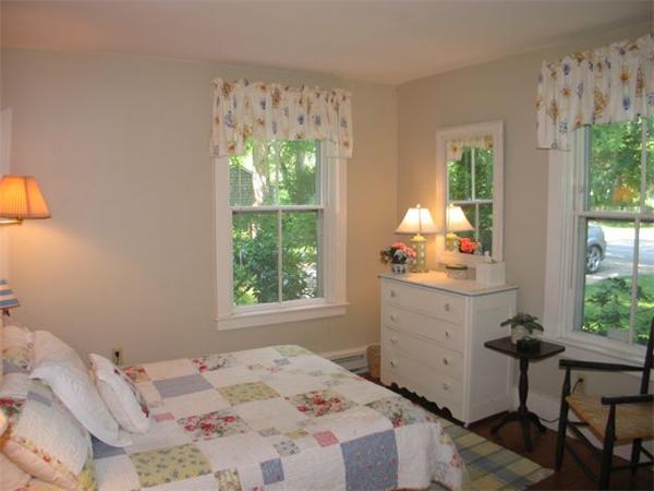 709 Old County Road West Tisbury, MA 02568 - Photo 11 of 22 a bedroom with a bed and a window