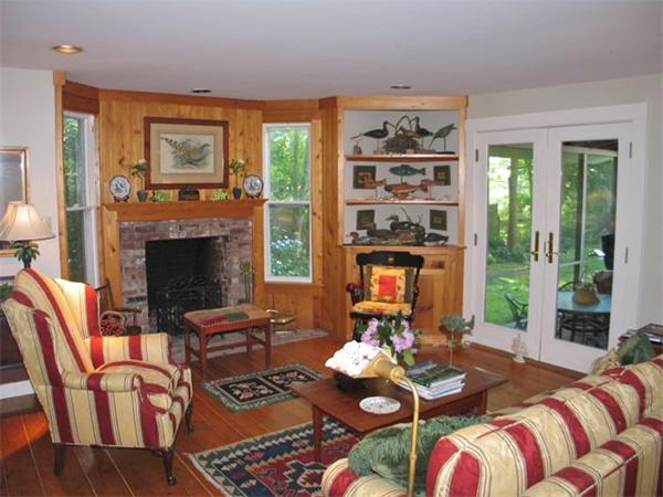 709 Old County Road West Tisbury, MA 02568 - Photo 4 of 22 a living room with furniture and a fireplace