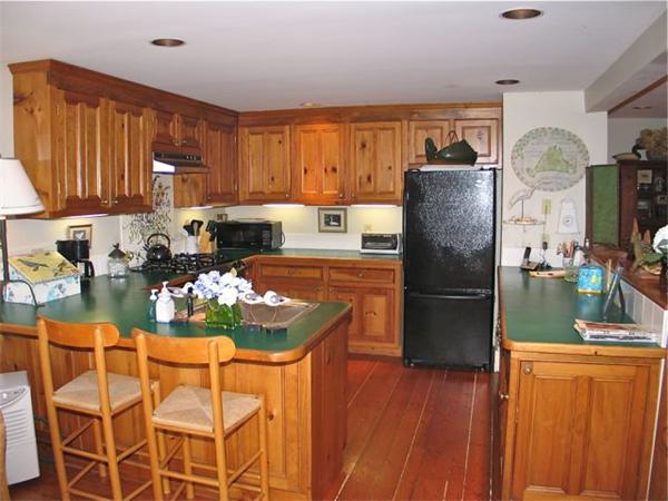 709 Old County Road West Tisbury, MA 02568 - Photo 6 of 22 a kitchen with stainless steel appliances granite countertop a refrigerator and a stove top oven