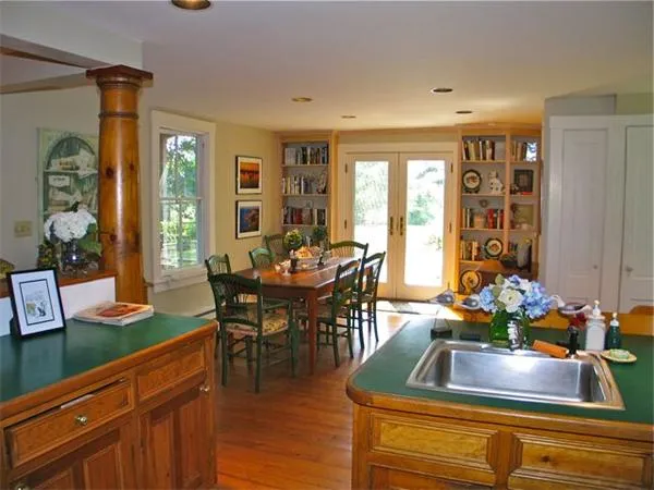 a view of a dining room with furniture and window