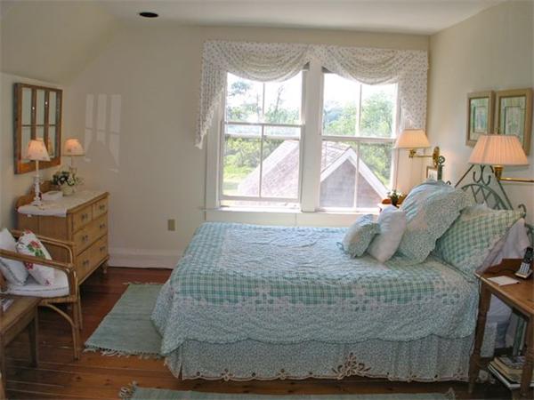 709 Old County Road West Tisbury, MA 02568 - Photo 9 of 22 a bedroom with a bed and wooden floor