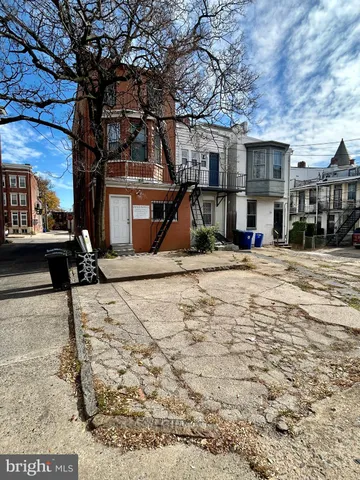a front view of a building with street view