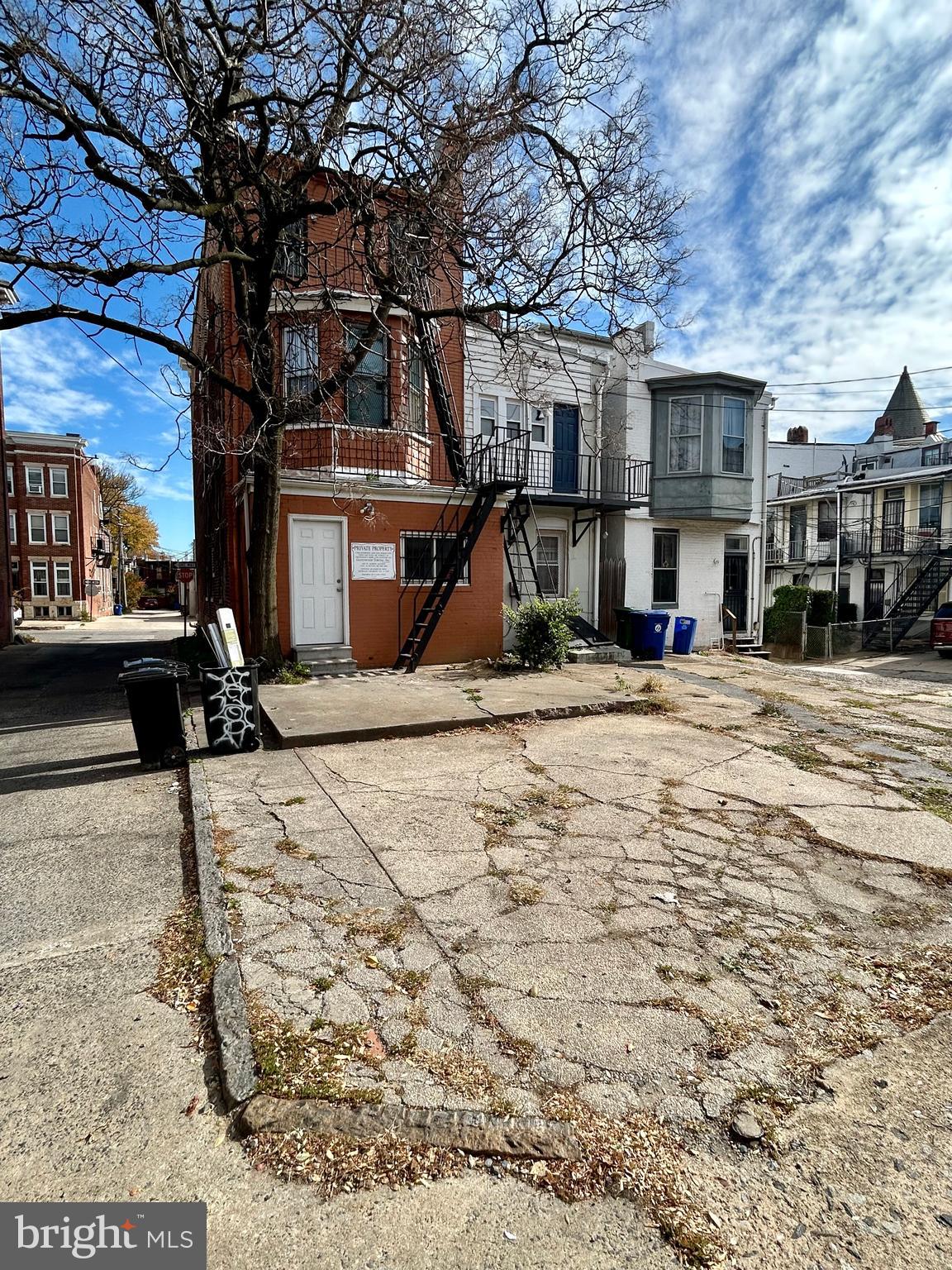 2504 North Calvert Street, Unit 1 Baltimore, MD 21218 - Photo 11 of 13 a front view of a building with street view