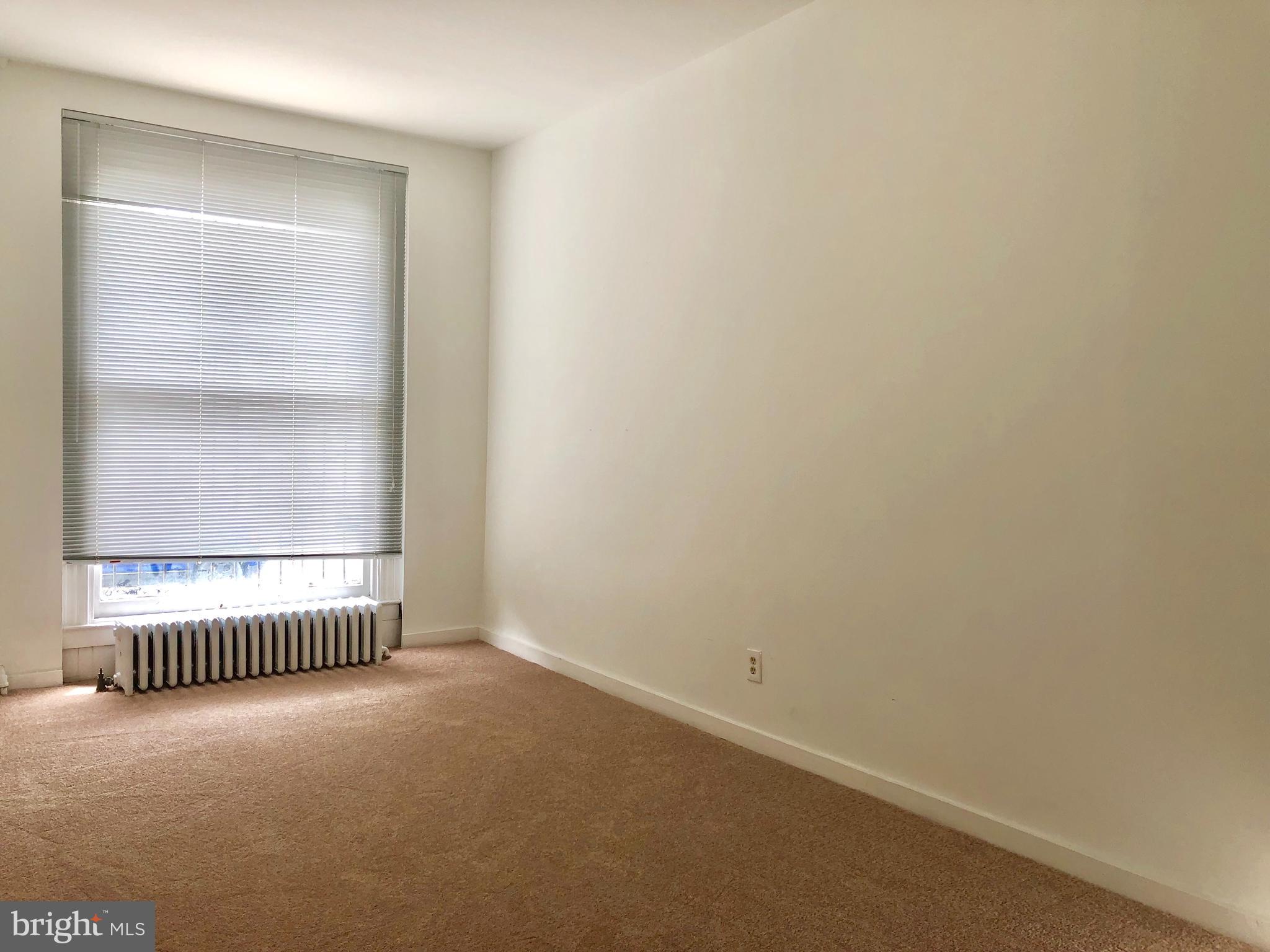 2504 North Calvert Street, Unit 1 Baltimore, MD 21218 - Photo 3 of 13 a view of an empty room