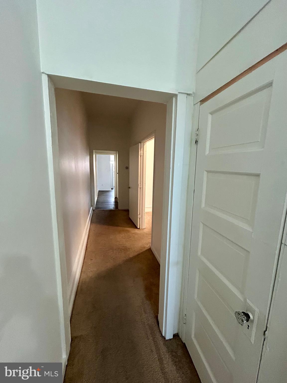 2504 North Calvert Street, Unit 1 Baltimore, MD 21218 - Photo 5 of 13 a view of a hallway with wooden floor