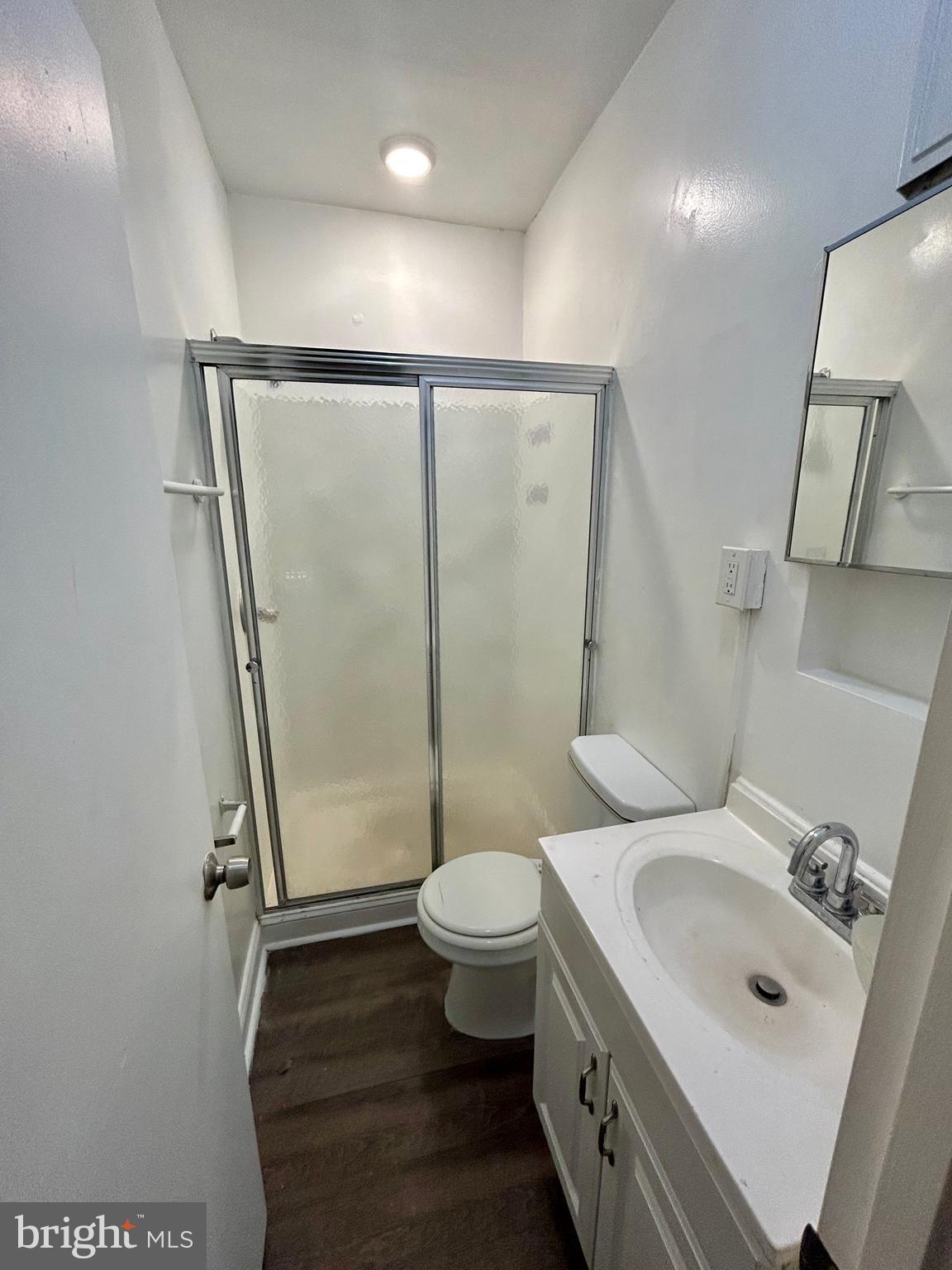 2504 North Calvert Street, Unit 1 Baltimore, MD 21218 - Photo 6 of 13 a bathroom with a sink toilet and shower