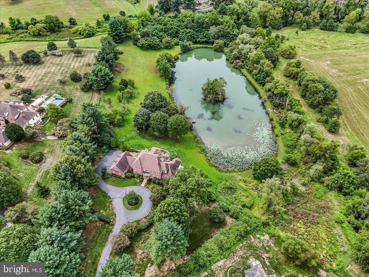 1015 Lambourne Road West Chester, PA 19382 - Photo 3 of 69 Aerial view of home, circular driveway and pond