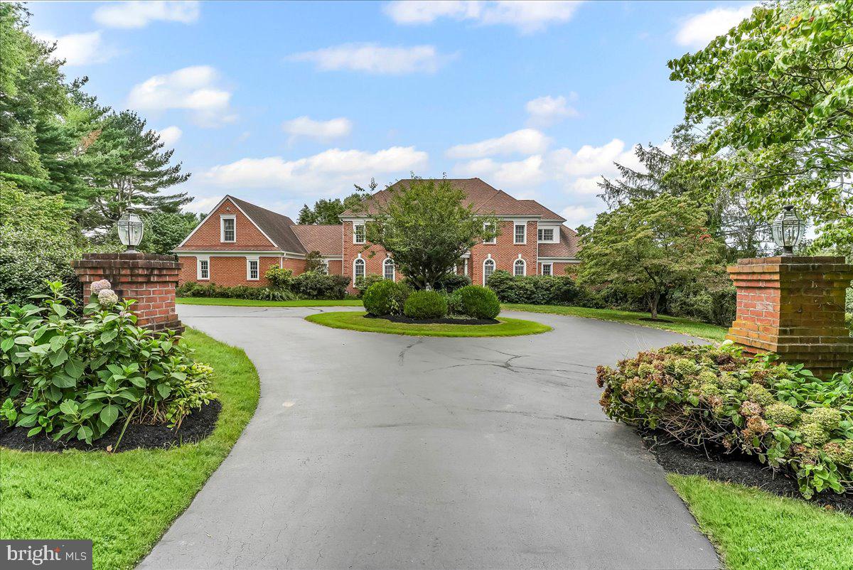 1015 Lambourne Road West Chester, PA 19382 - Photo 4 of 69 Driveway approach through the pillars to the home