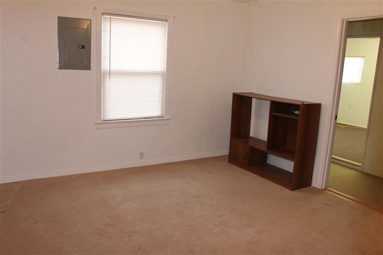 301 Chestnut Street Ropesville, TX 79358 - Photo 8 of 9 an empty room with windows