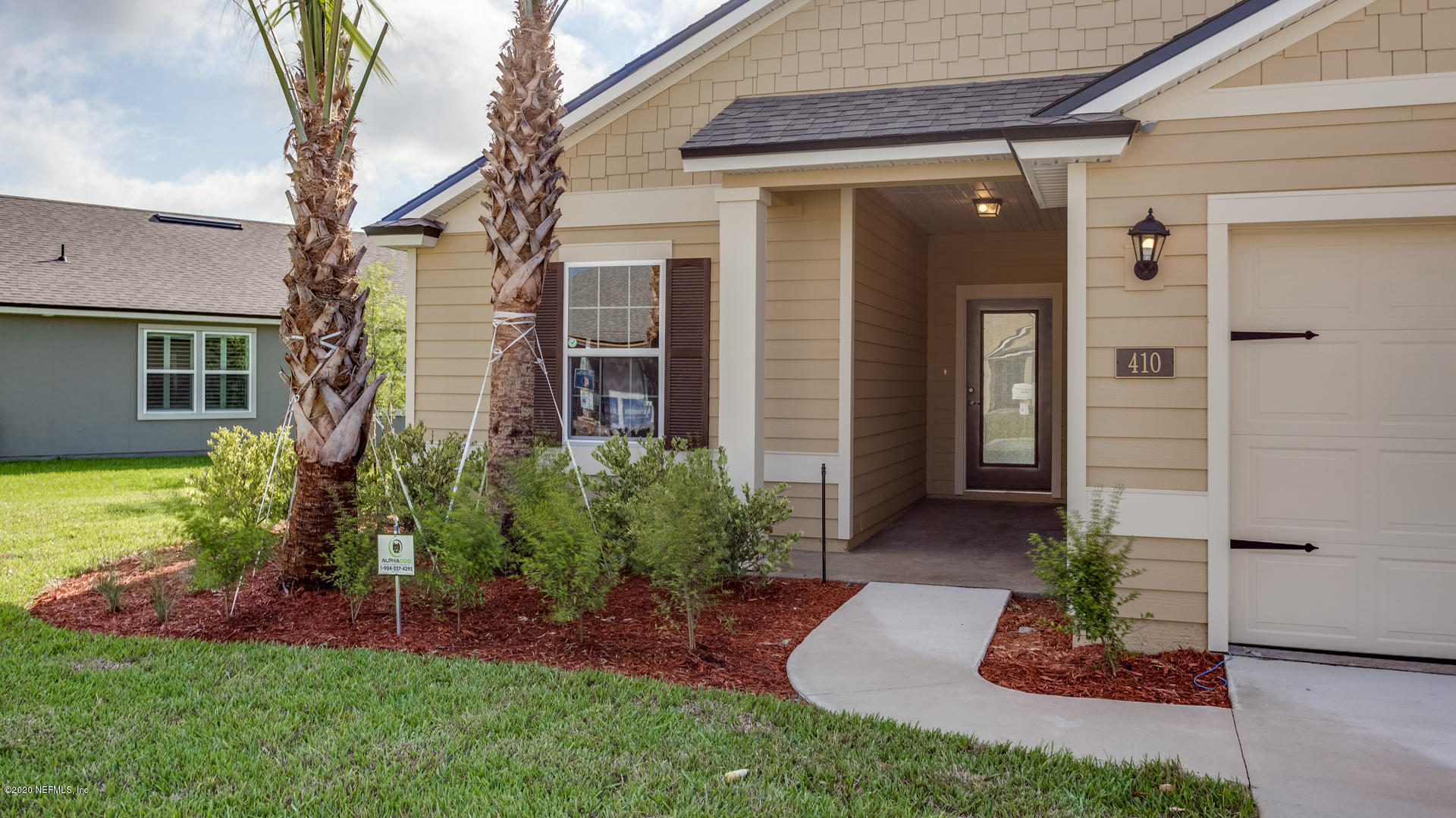 410 Palace Drive St. Augustine, FL 32084 - Photo 2 of 29 a view of a front of house with a yard