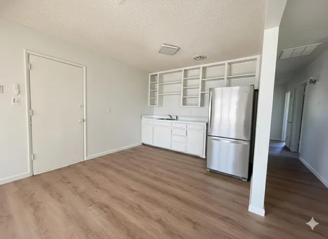 a kitchen with a refrigerator a sink and dishwasher