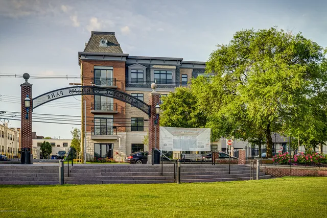 a front view of a building with garden