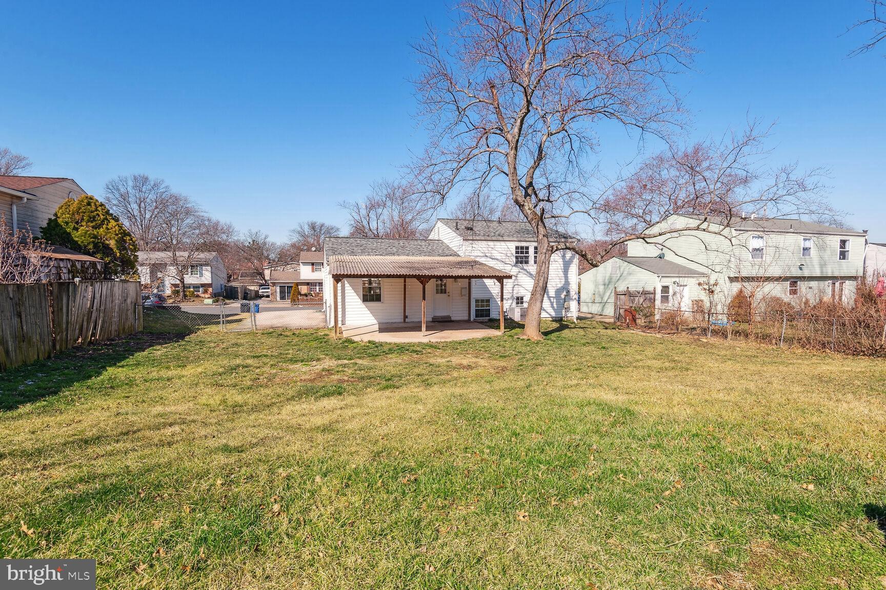120 North Garfield Road Sterling, VA 20164 - Photo 18 of 19 Fenced Flat Backyard with Covered Patio