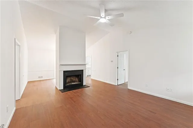 a view of a livingroom with a fireplace a fireplace and wooden floor
