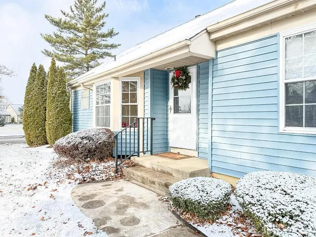 a view of a house with a snow on the road