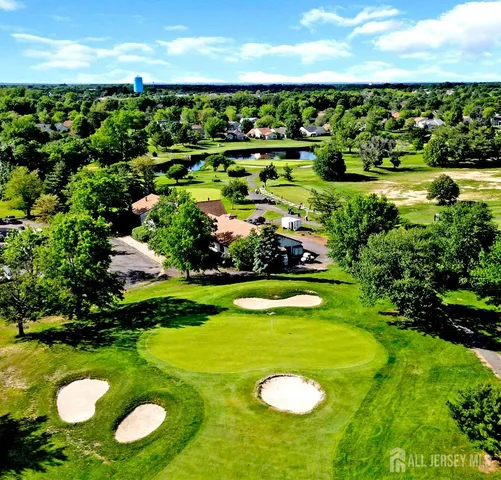 a view of a golf course with a swimming pool