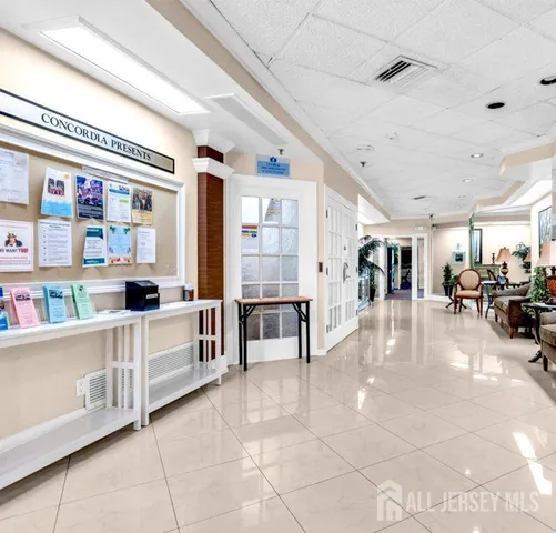 a living room with furniture and natural light