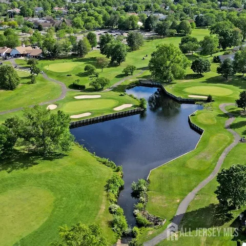 an aerial view of a golf course with a garden