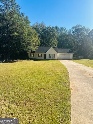 a view of bathroom with swimming pool and trees in the background