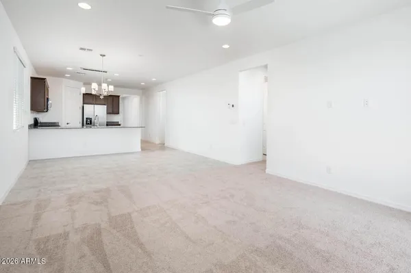 a view of a kitchen with a sink and a window