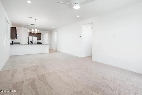 a view of a kitchen with a sink and a window