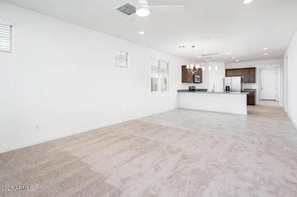 a view of a kitchen with a sink and cabinets