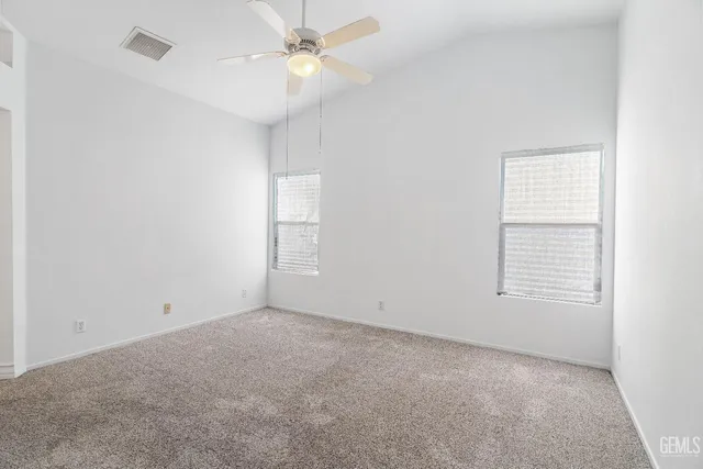 a bathroom with a granite countertop sink a tub and a mirror