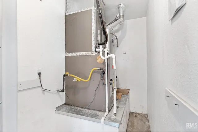 a view of a house with a wooden fence