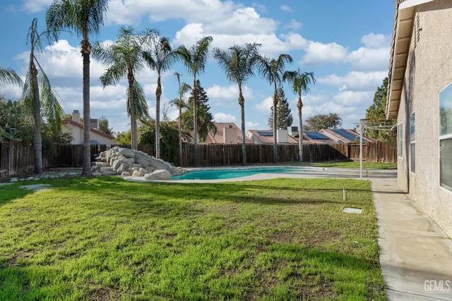 an aerial view of houses with outdoor space